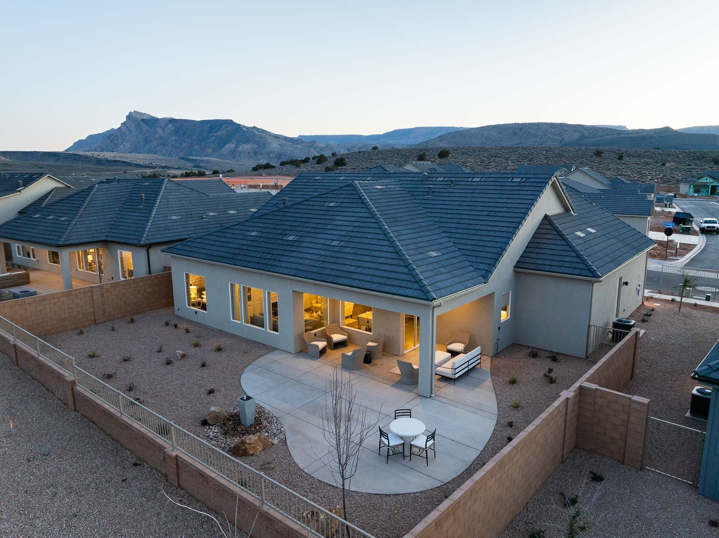 Evergreen Rear Aerial at Twilight — SunRiver Firelight Toquerville, red sandstone cliffs in background